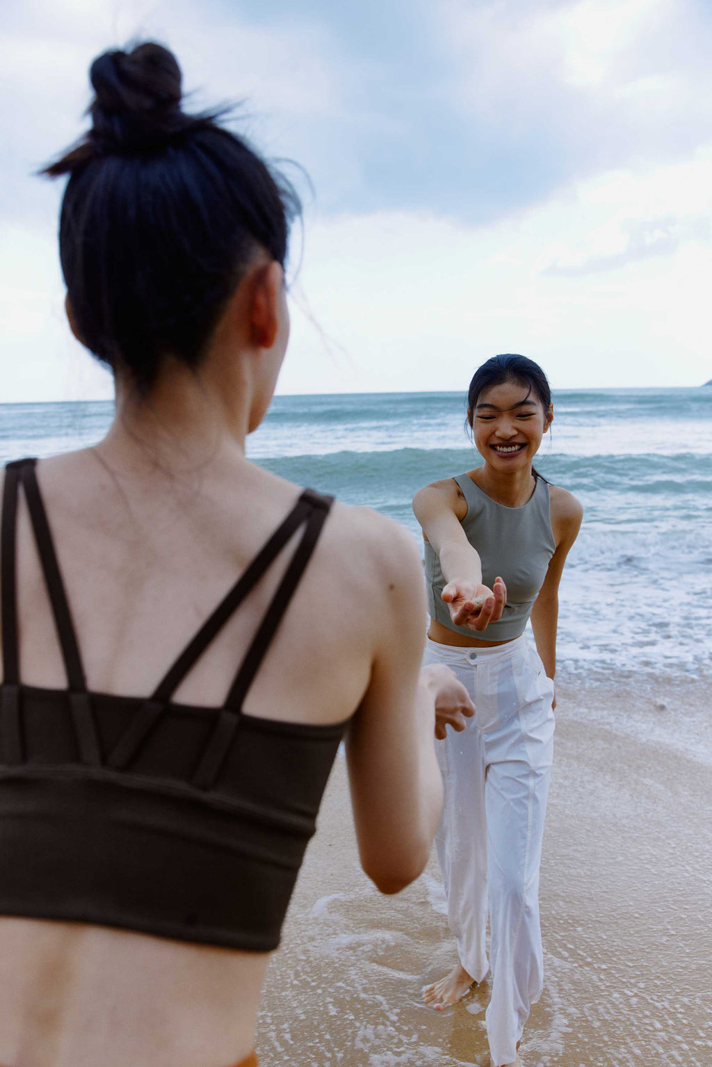 woman in blue pants and grey tank