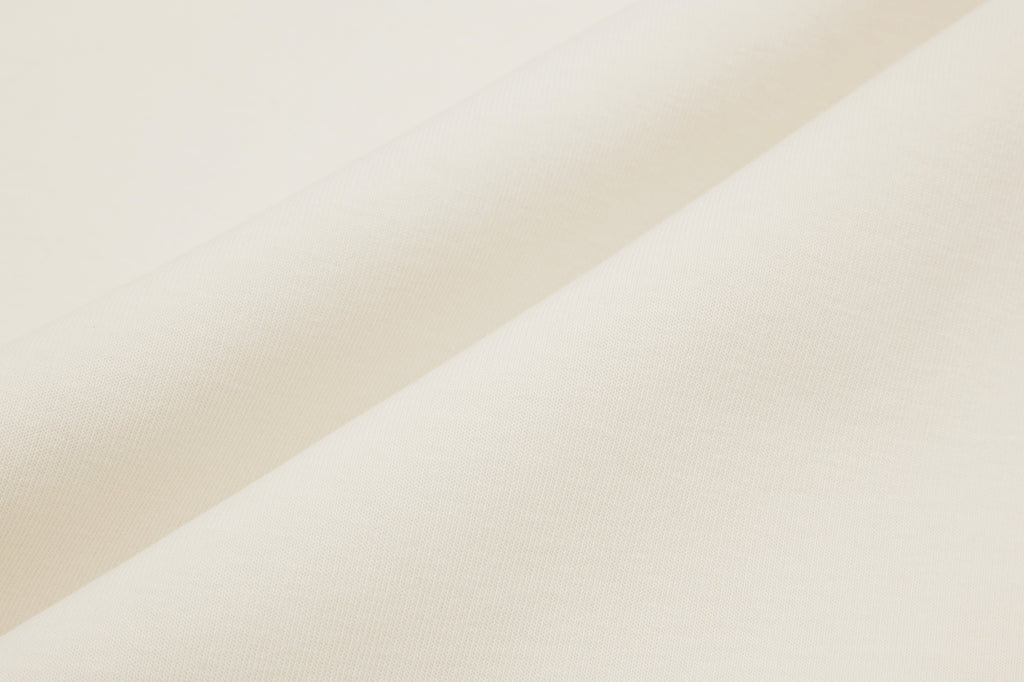 Fabric details of white cardigan