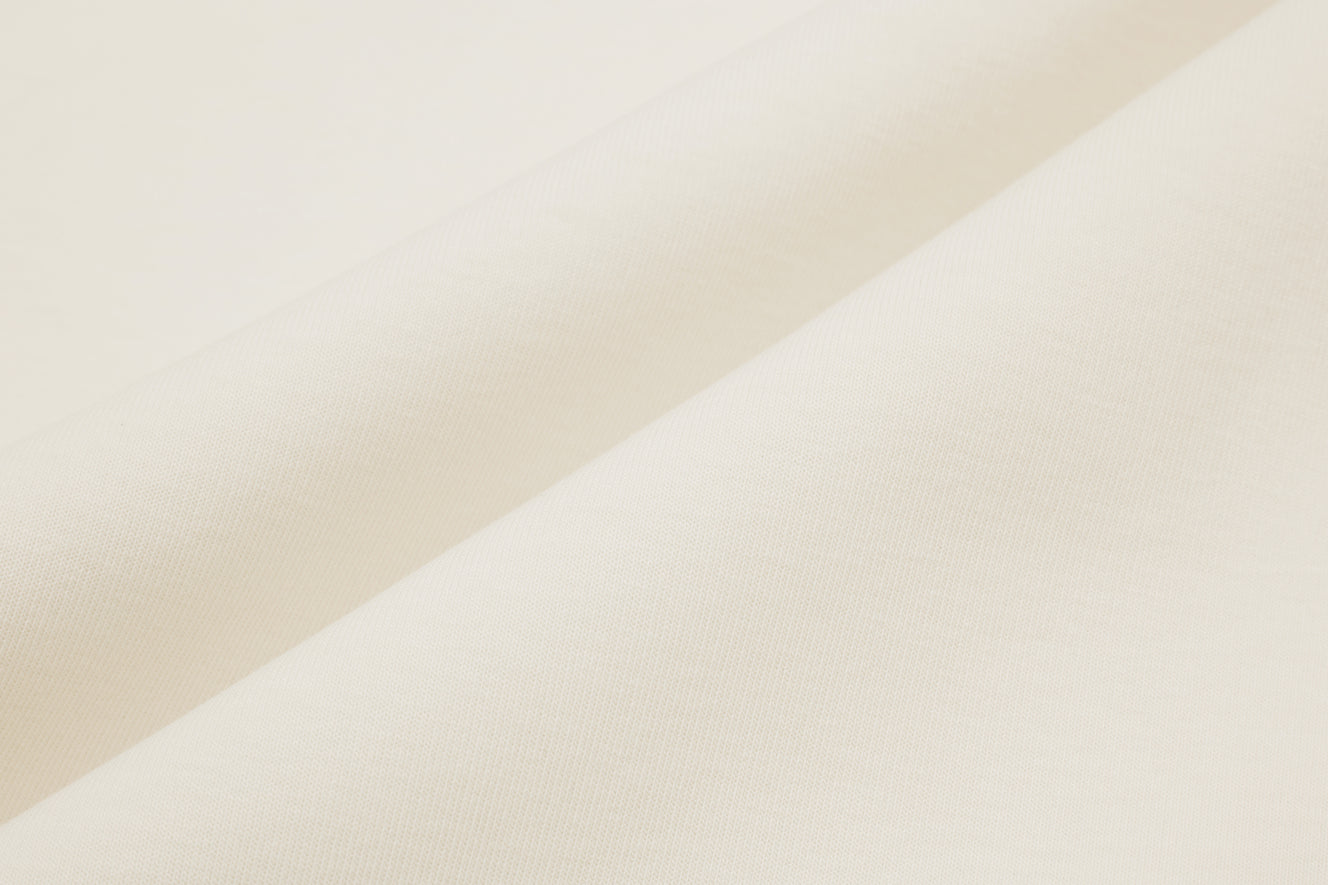 Fabric details of white cardigan