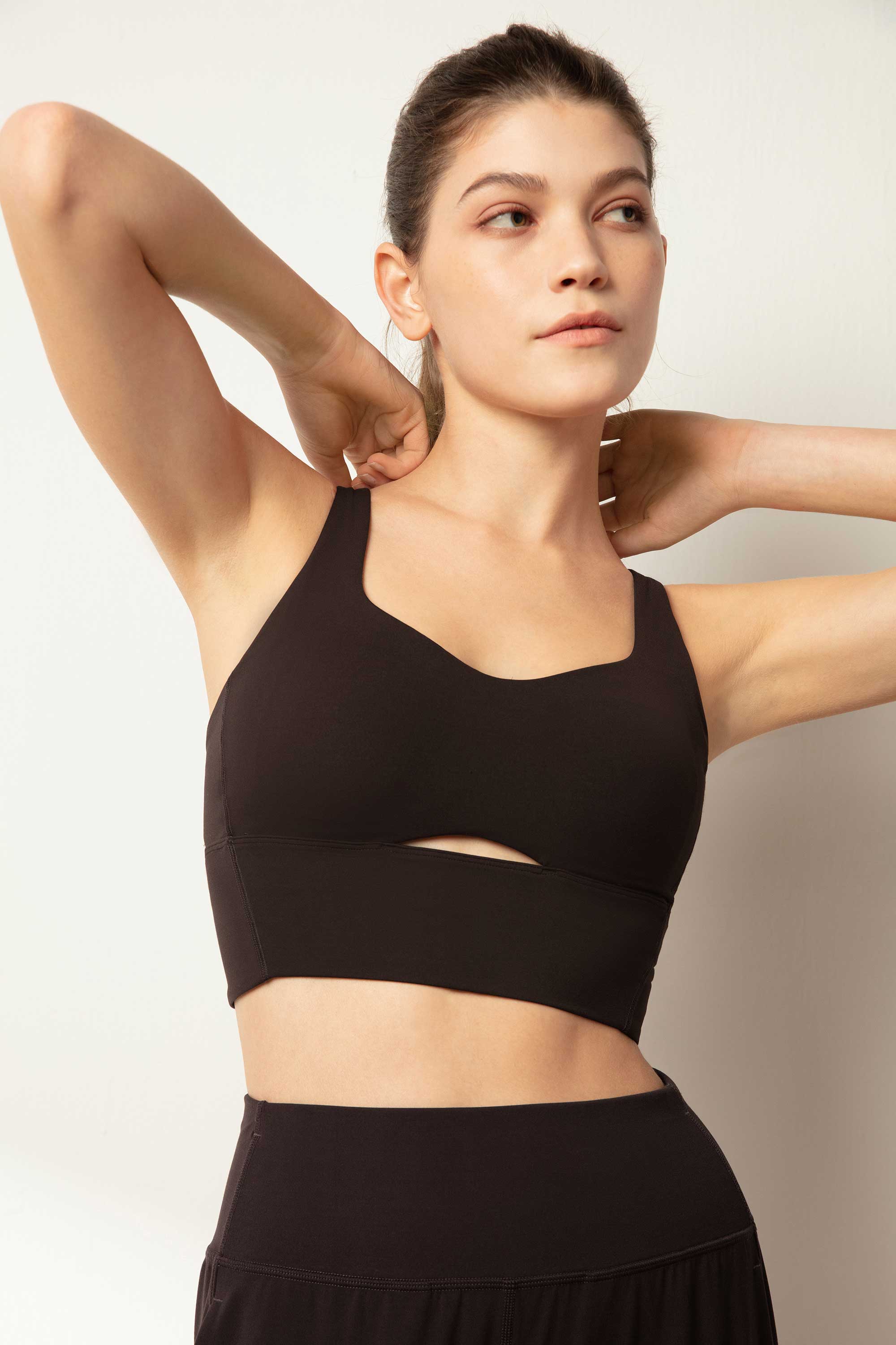 woman in black sports bra