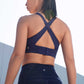 back of woman in blue sports bra and leggings
