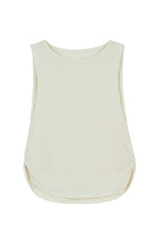 flat lay image of white tank top