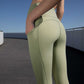 back of woman in green leggings
