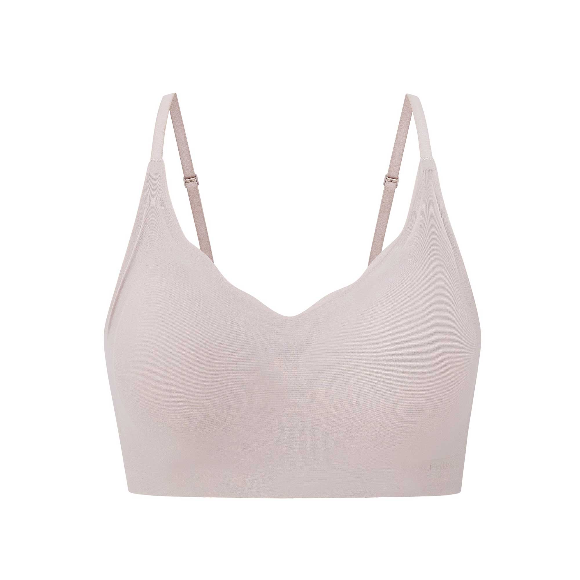 Flat lay of a light pink bra