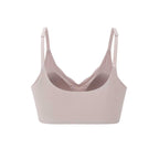 the back of a light pink pull over bra