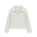 flat lay of the white polo shirt