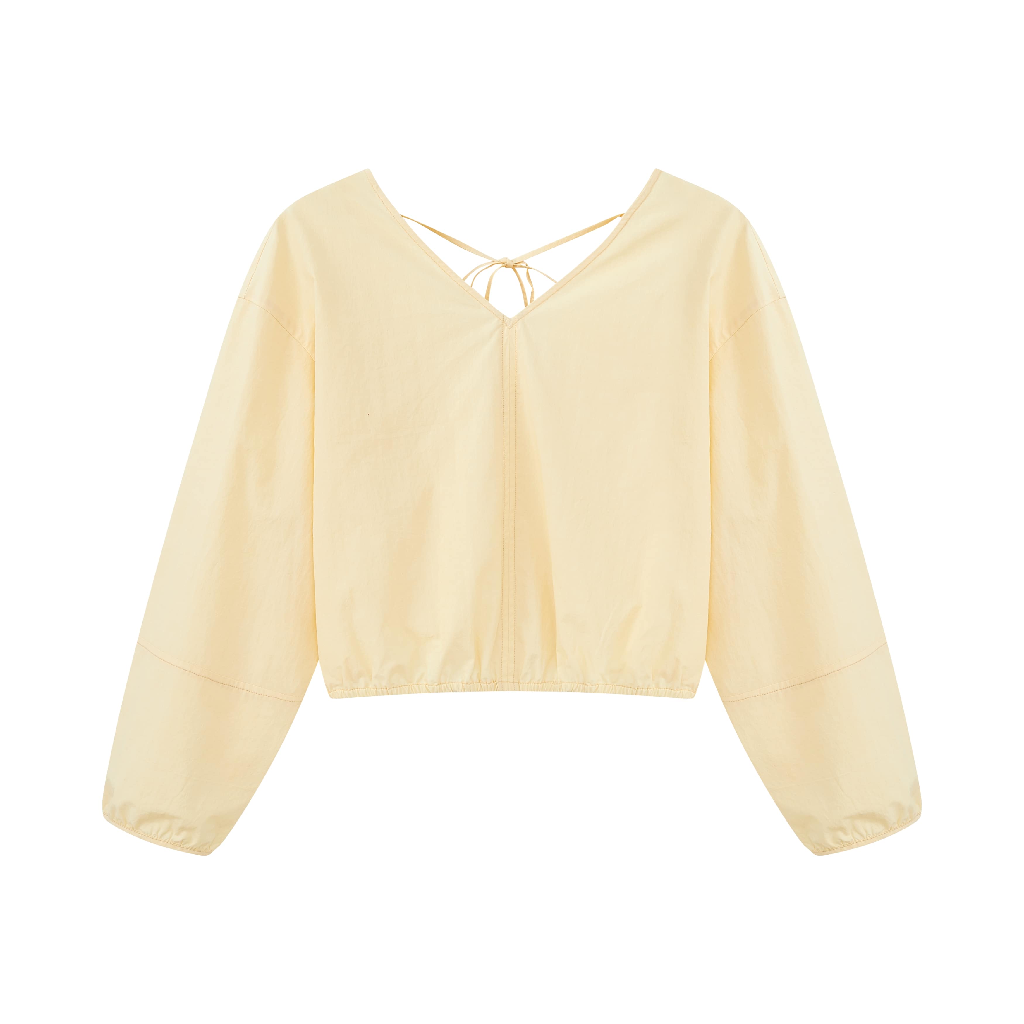 Flat lay of yellow top.