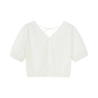 Flat lay of white top.