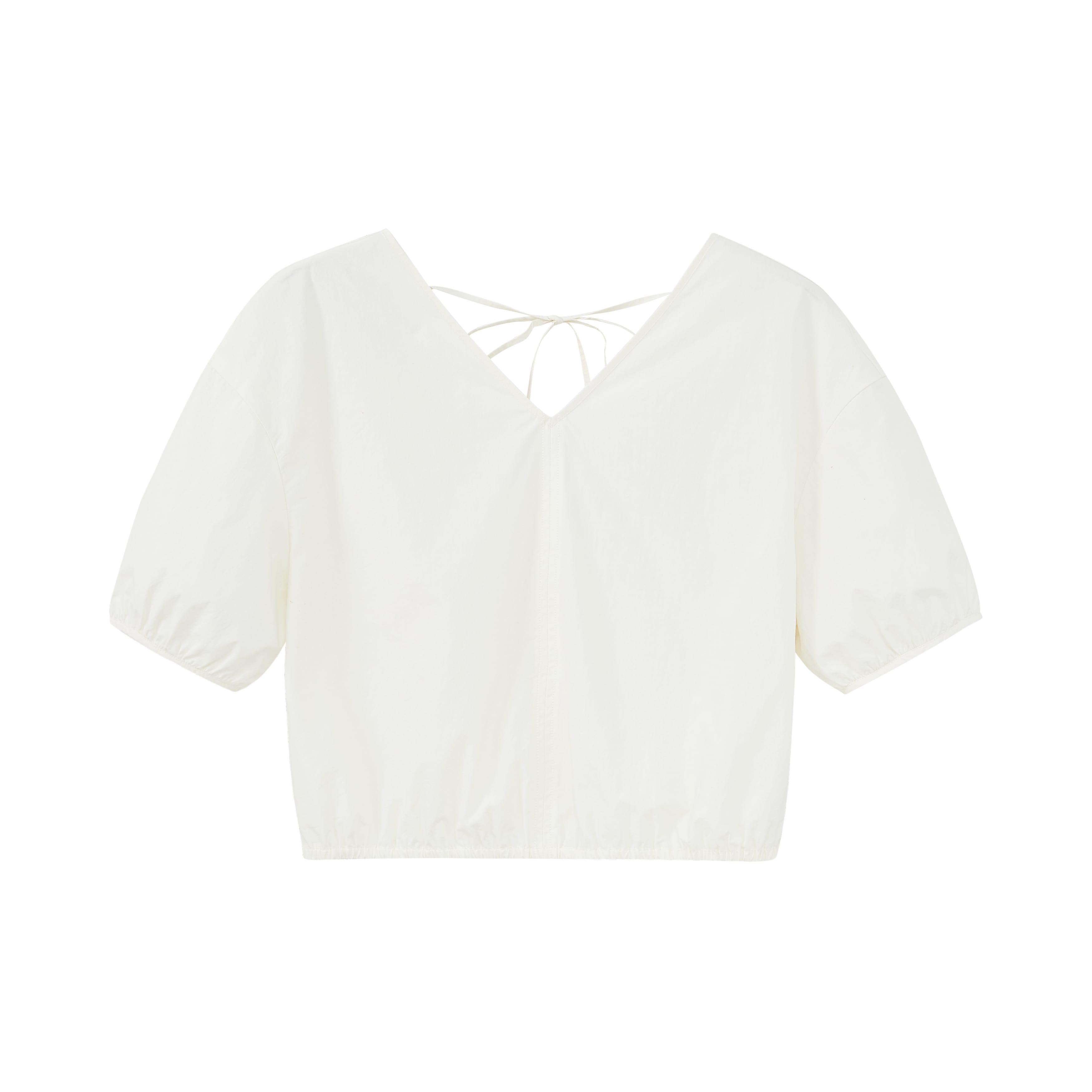 Flat lay of white top.
