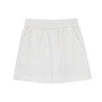 Flat lay of white shorts.