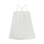 Flat lay of cream-colored pajama dress.