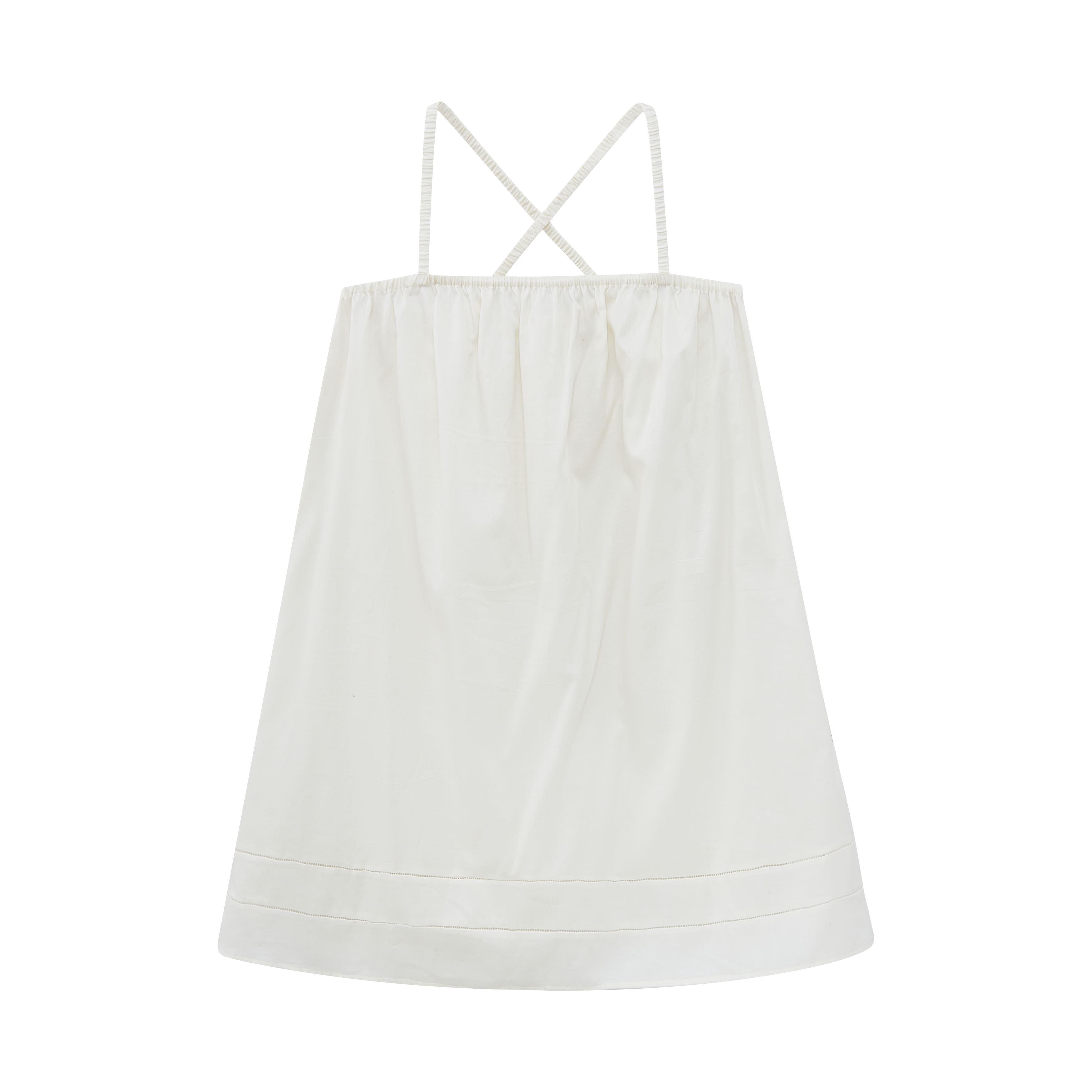 Flat lay of cream-colored pajama dress.