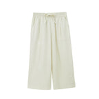 Flat lay of off-white cropped pajama pants