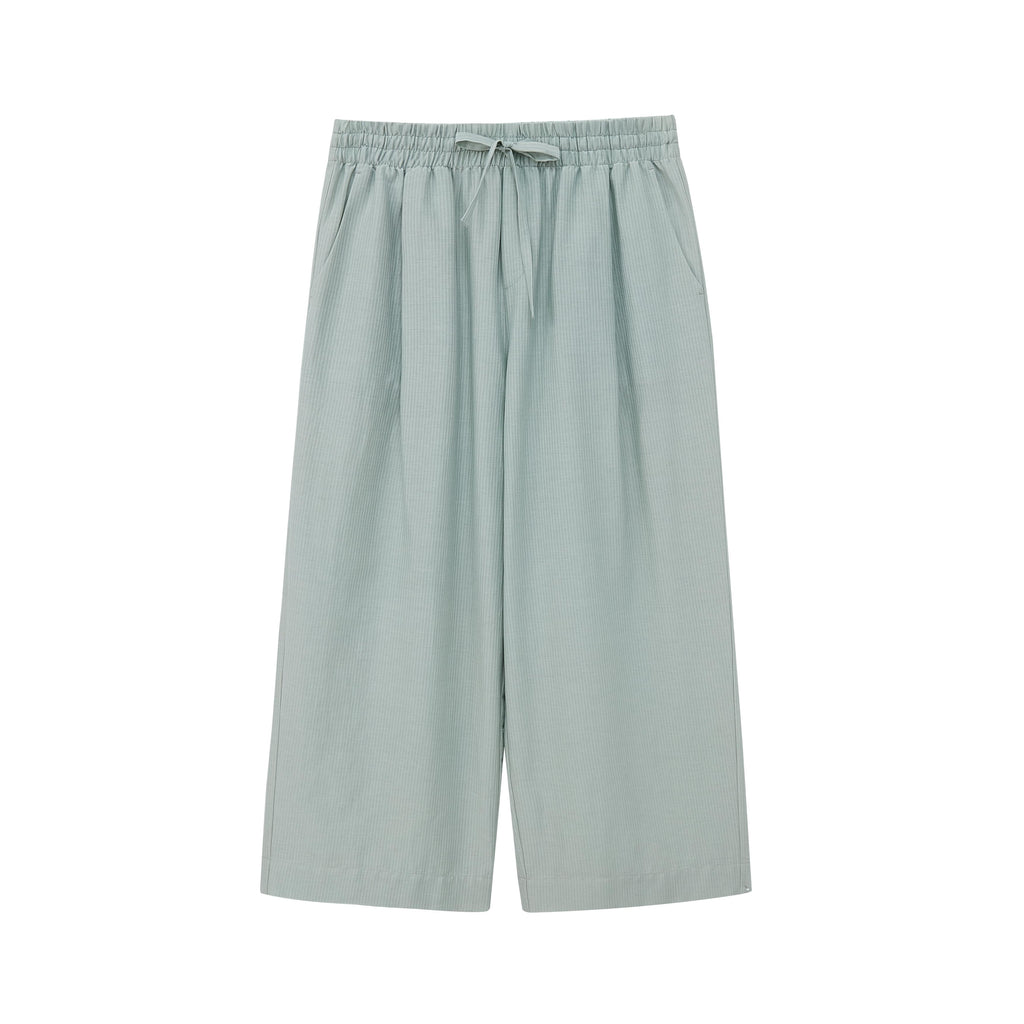Flat lay of seafoam green cropped pajama pants