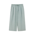 Flat lay of seafoam green cropped pajama pants