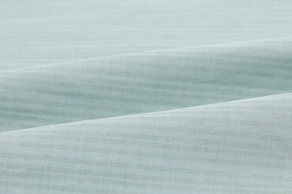 Closeup of seaforam green fabric