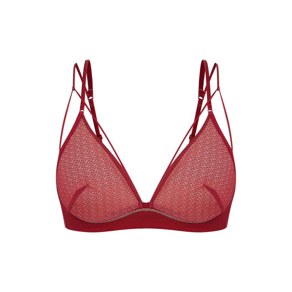 Flat lay of red lace bra.