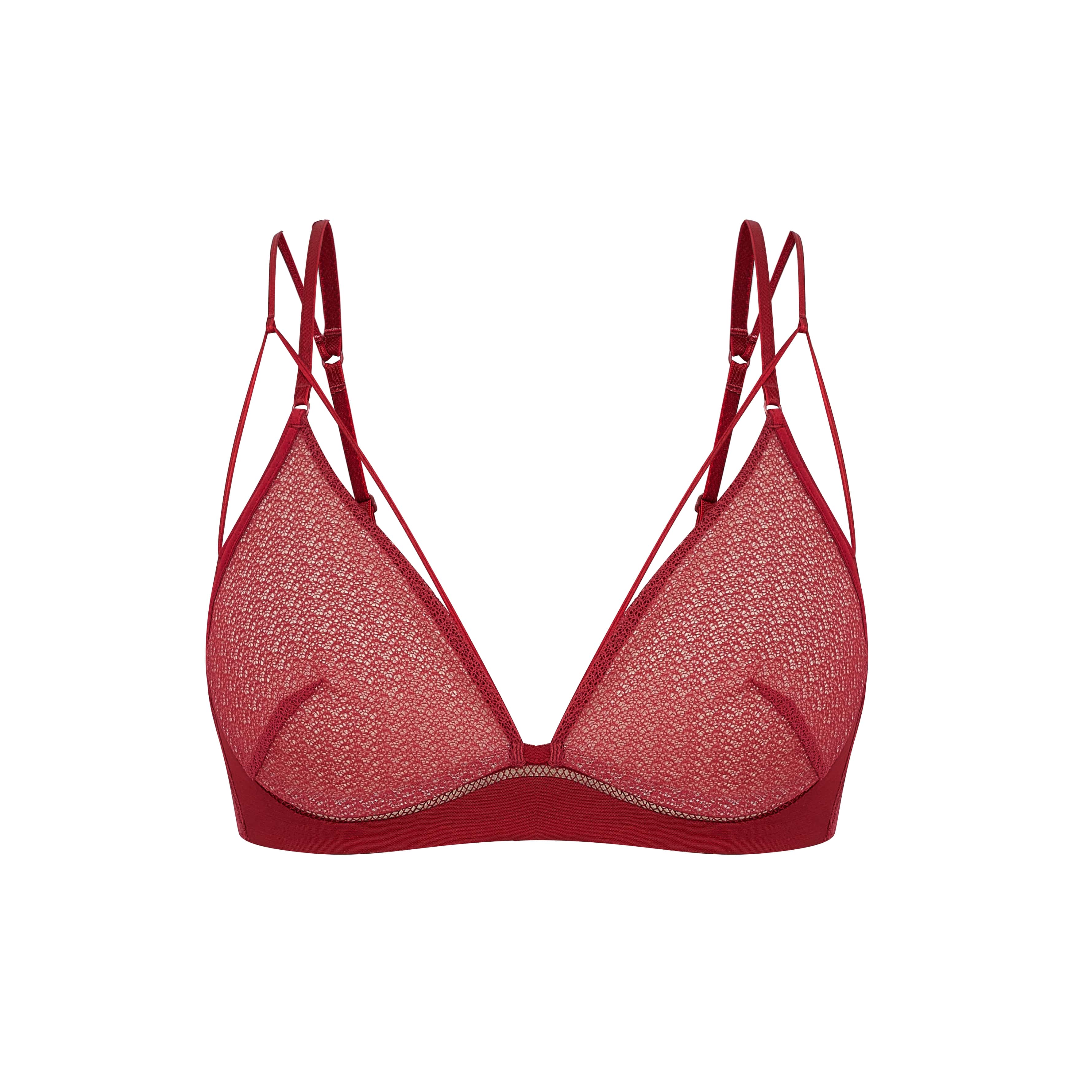 Flat lay of red lace bra.