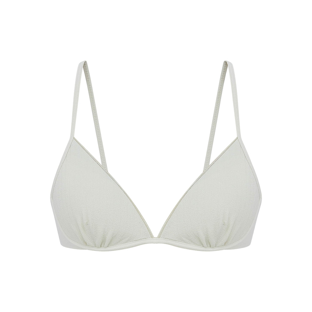 close up view of the flat lay of the white bra