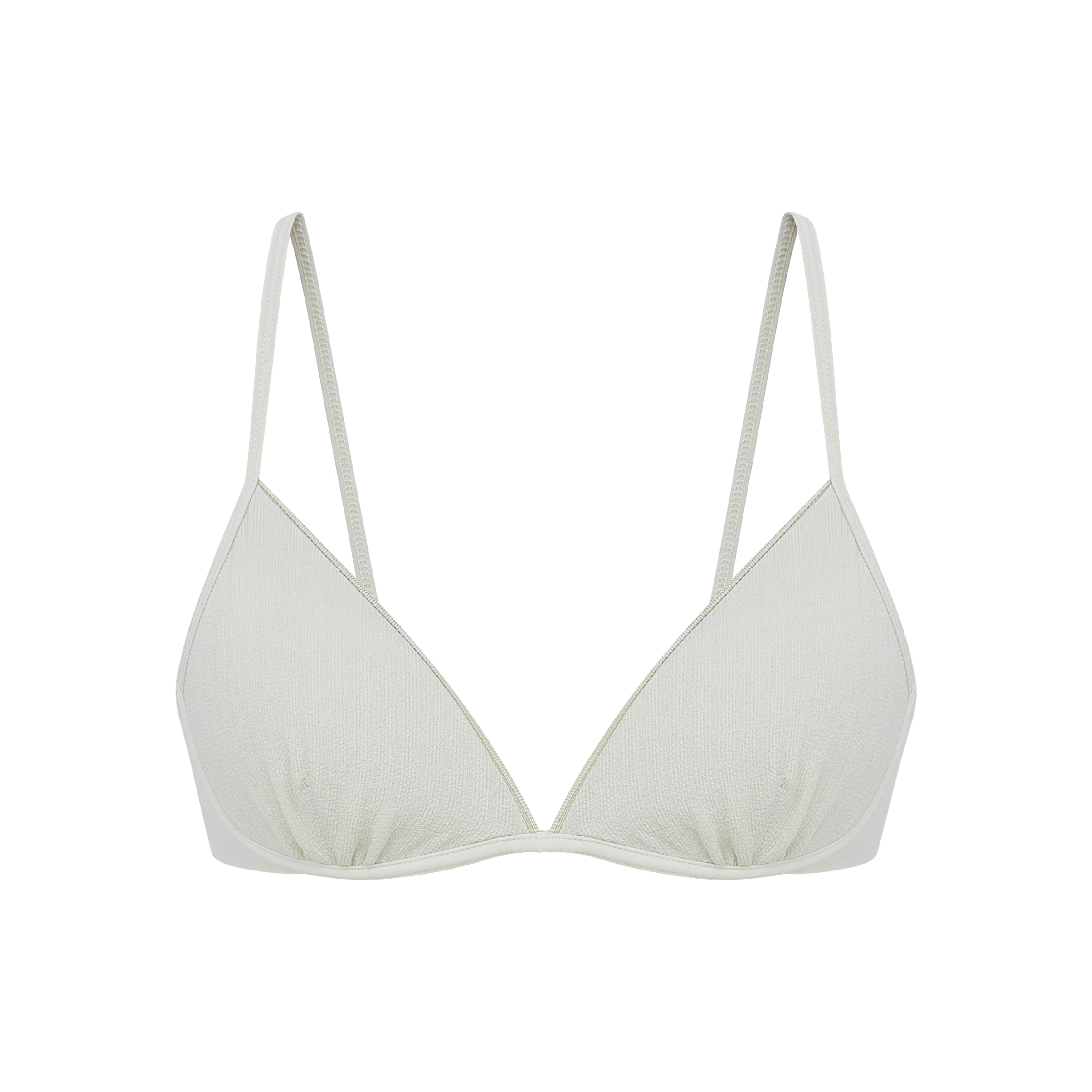 close up view of the flat lay of the white bra