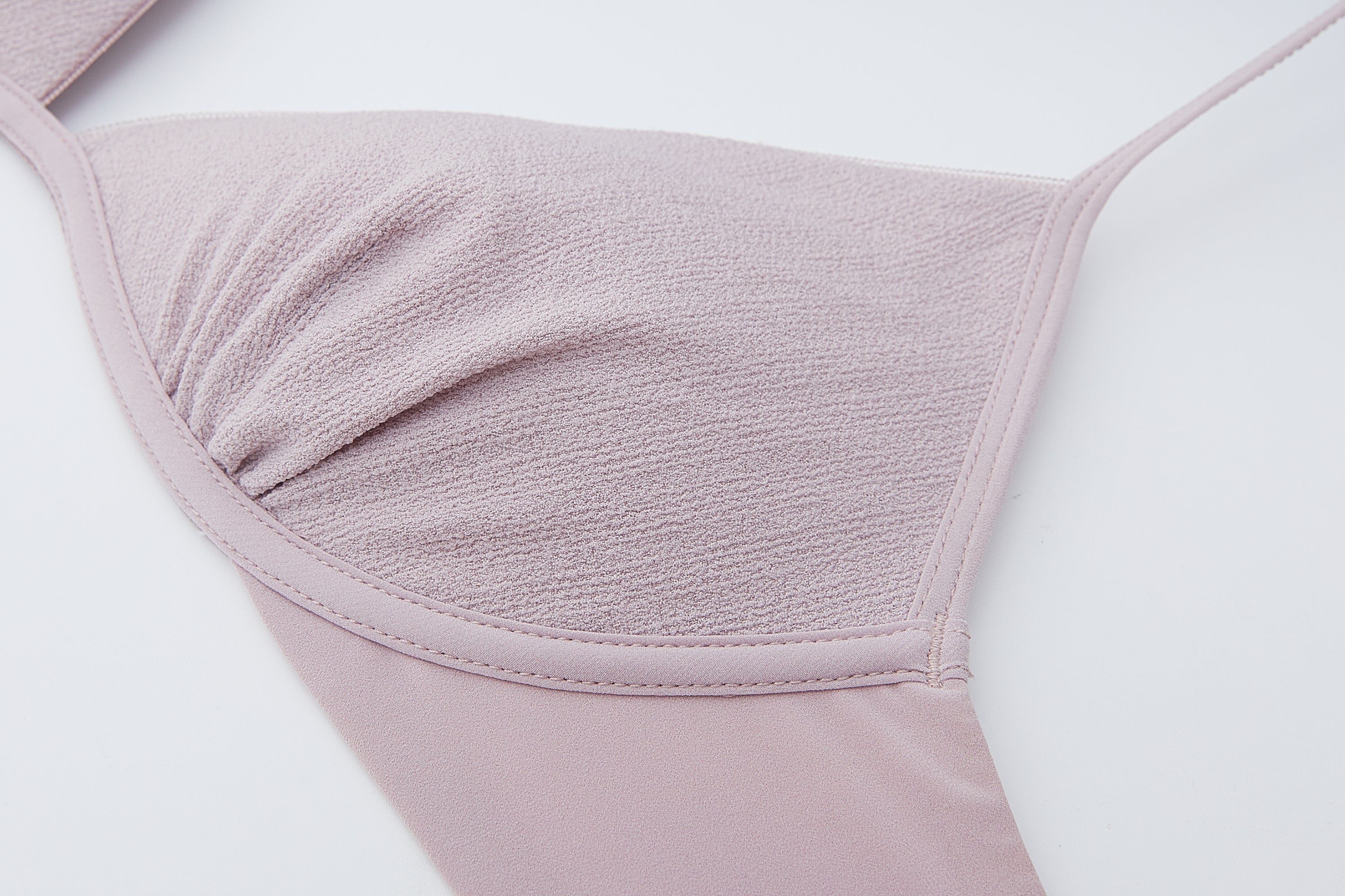 close up view of the flat lay of the light purple bra
