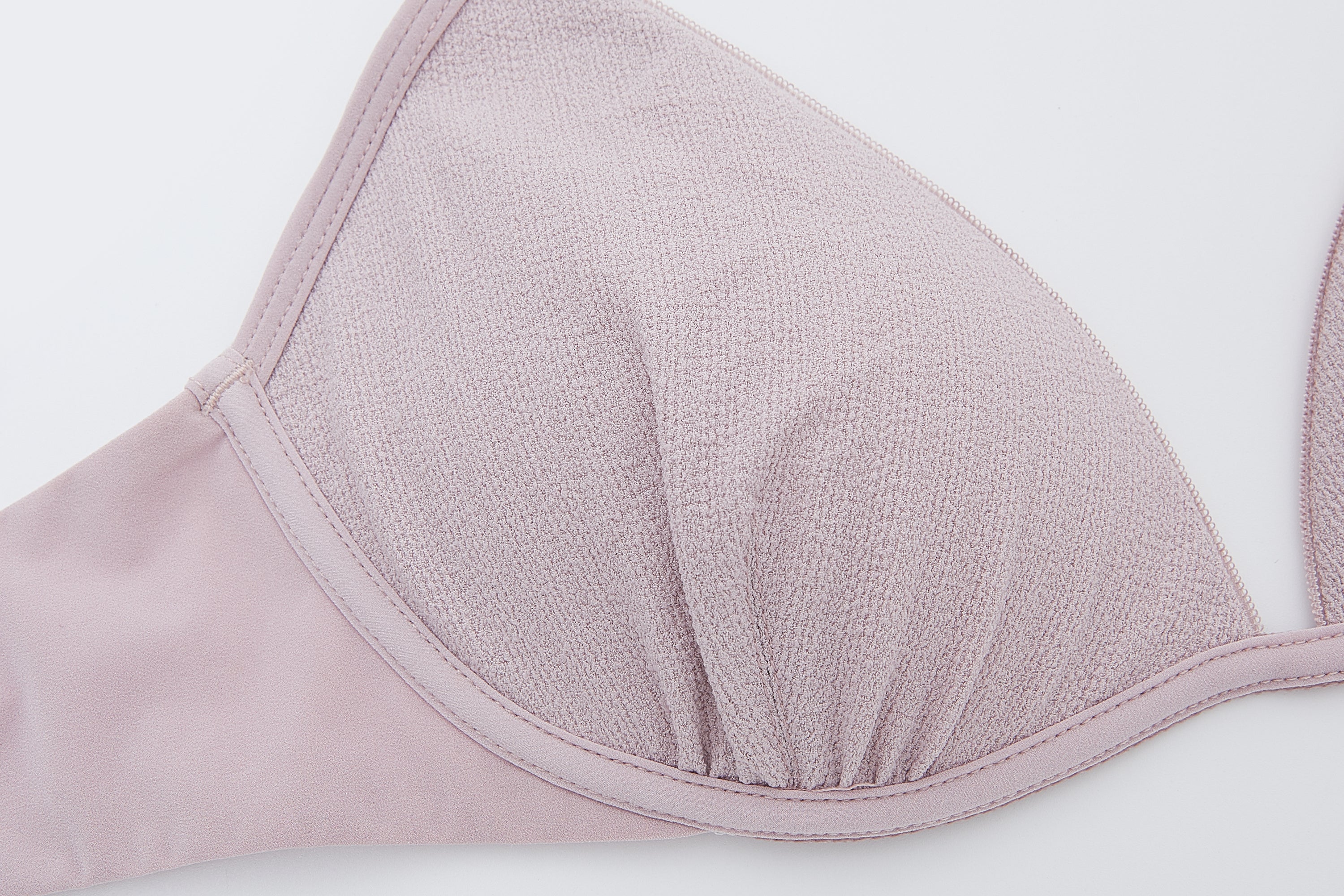 close up view of the flat lay of the light purple bra