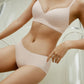 woman wearing light pink bra and brief