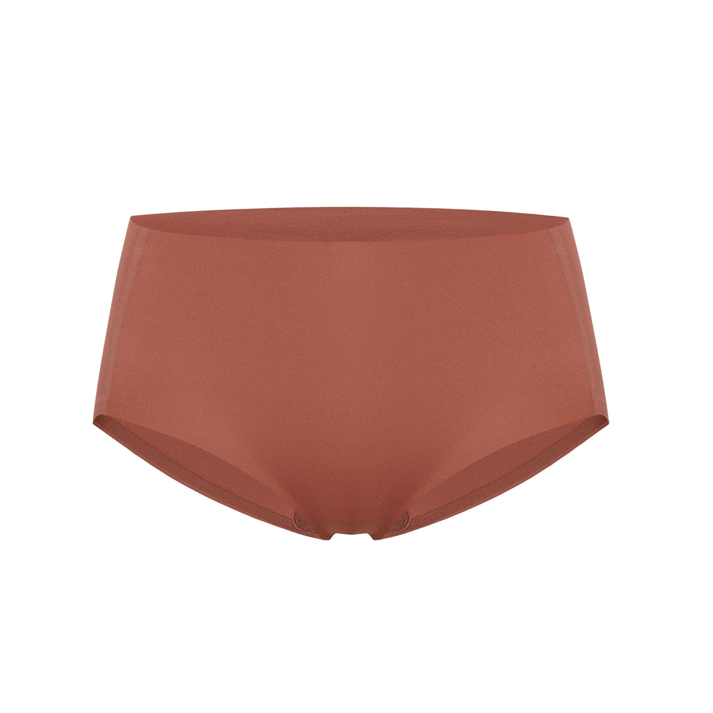 Flat lay image of rust-colored underwear