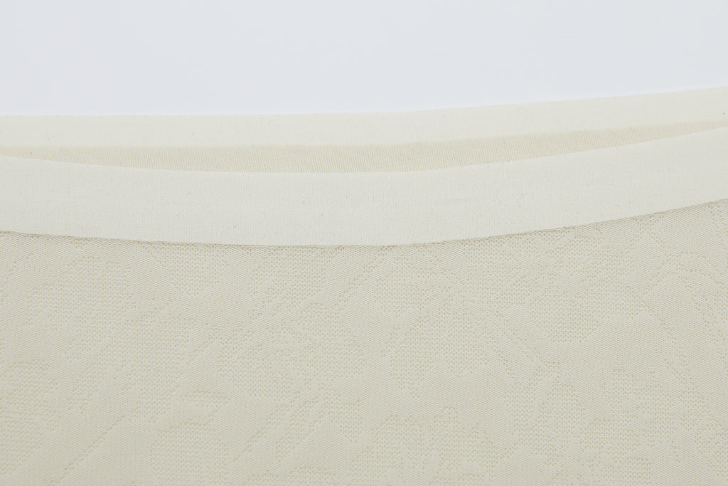 Close-up of off-white lace fabric