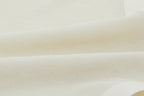 Close-up of off-white lace fabric