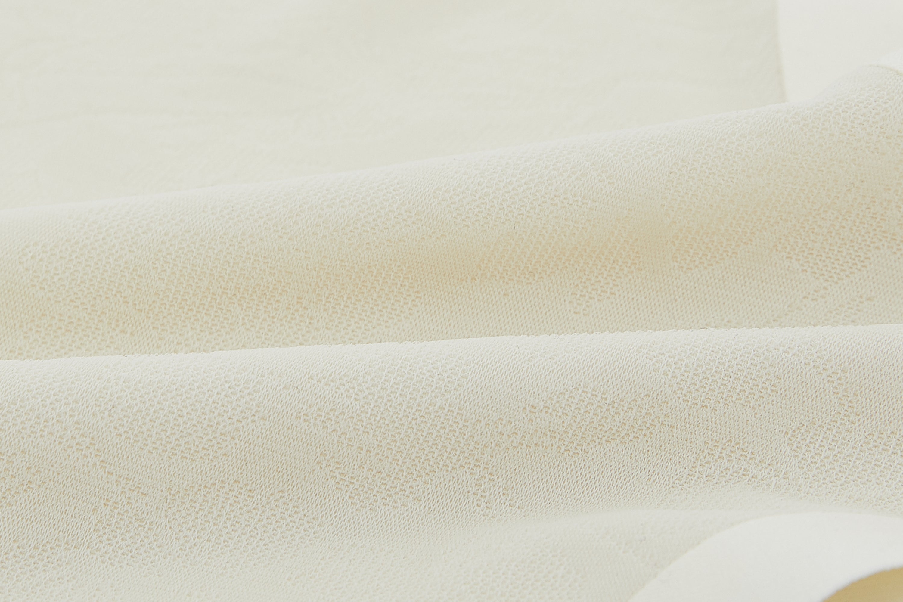 Close-up of off-white lace fabric