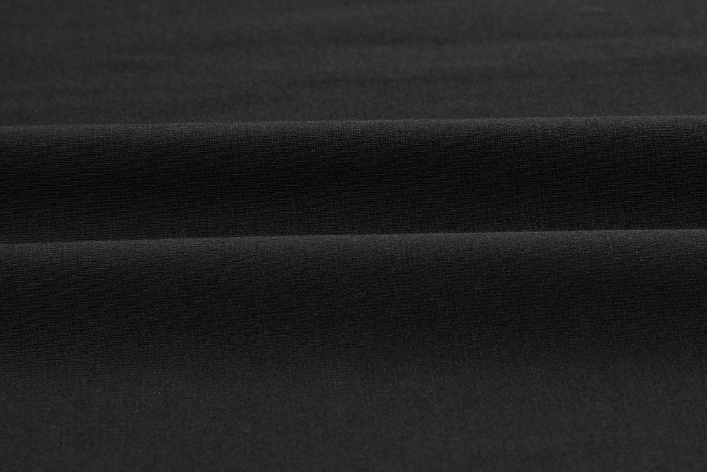 Closeup of black fabric. Black color.