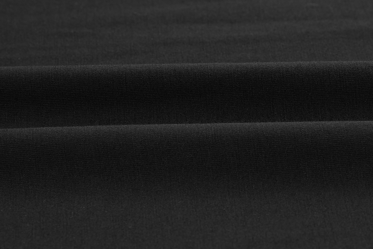 Closeup of black fabric. Black color.