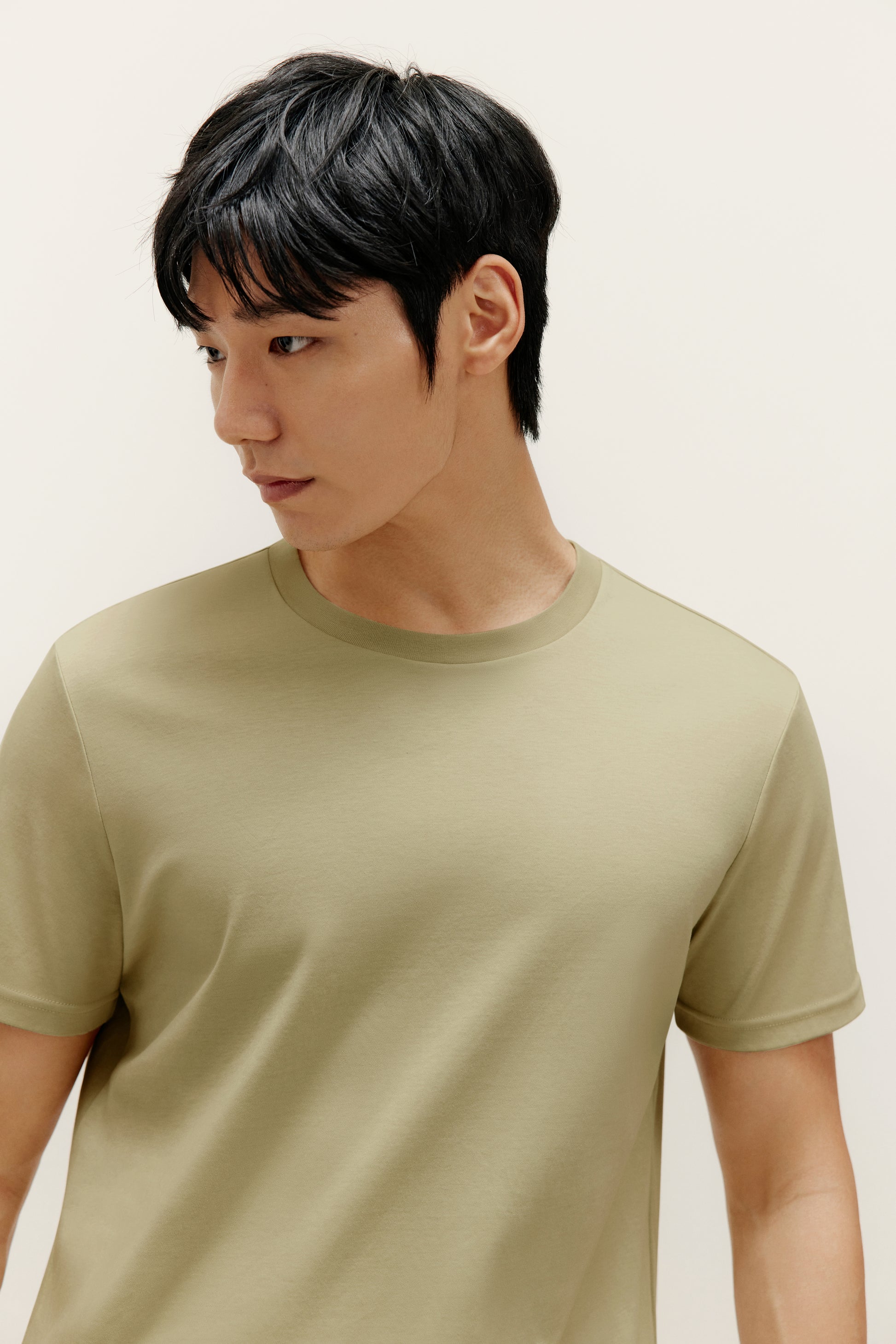 a man wearing green t shirt