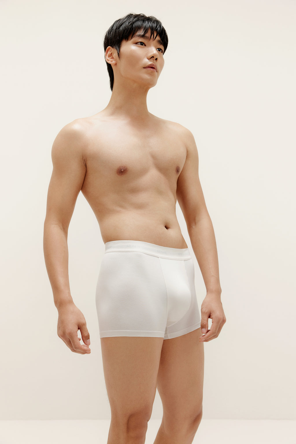 A man wearing white brief. Bright White color. 