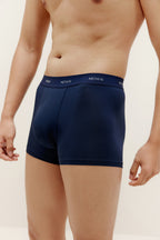 A man wearing navy brief. Navy color.