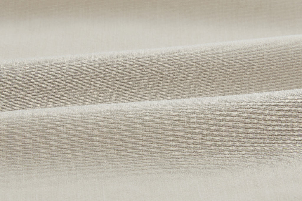 Closeup of beige fabric. Camel color.