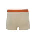 Flat lay of back of tan boxer briefs with orange waistband. Oatmeal color. 