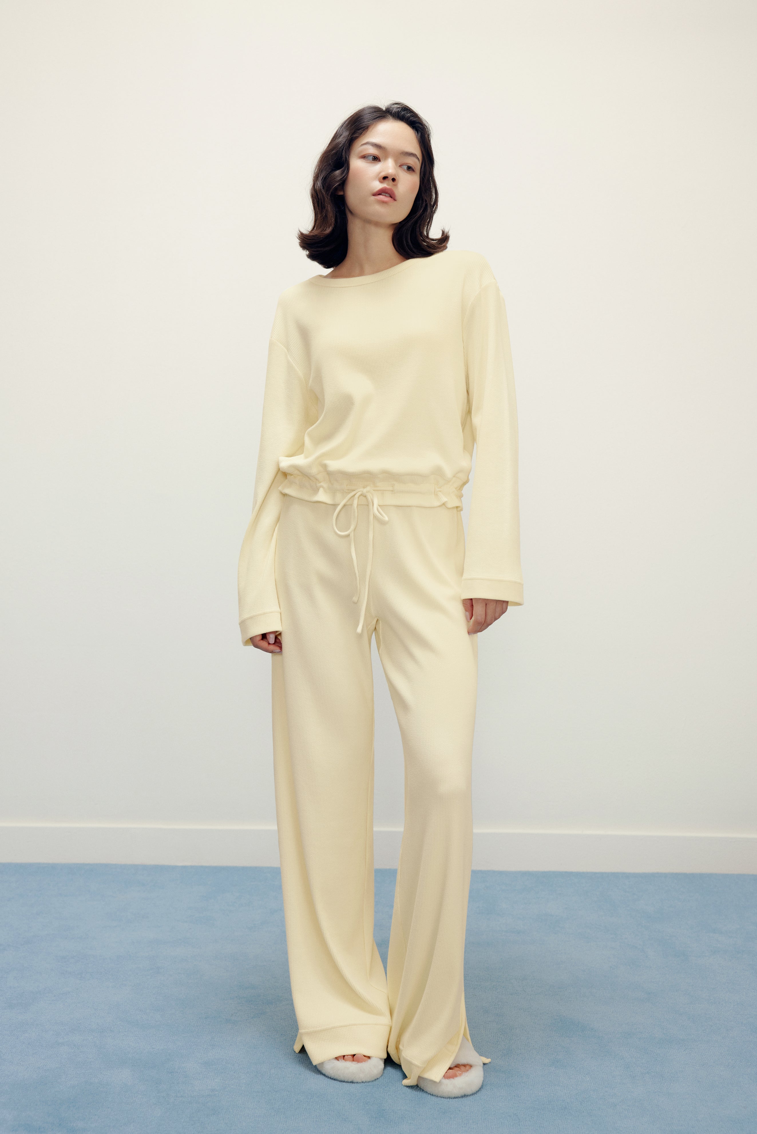 woman in yellow pajama top and pants