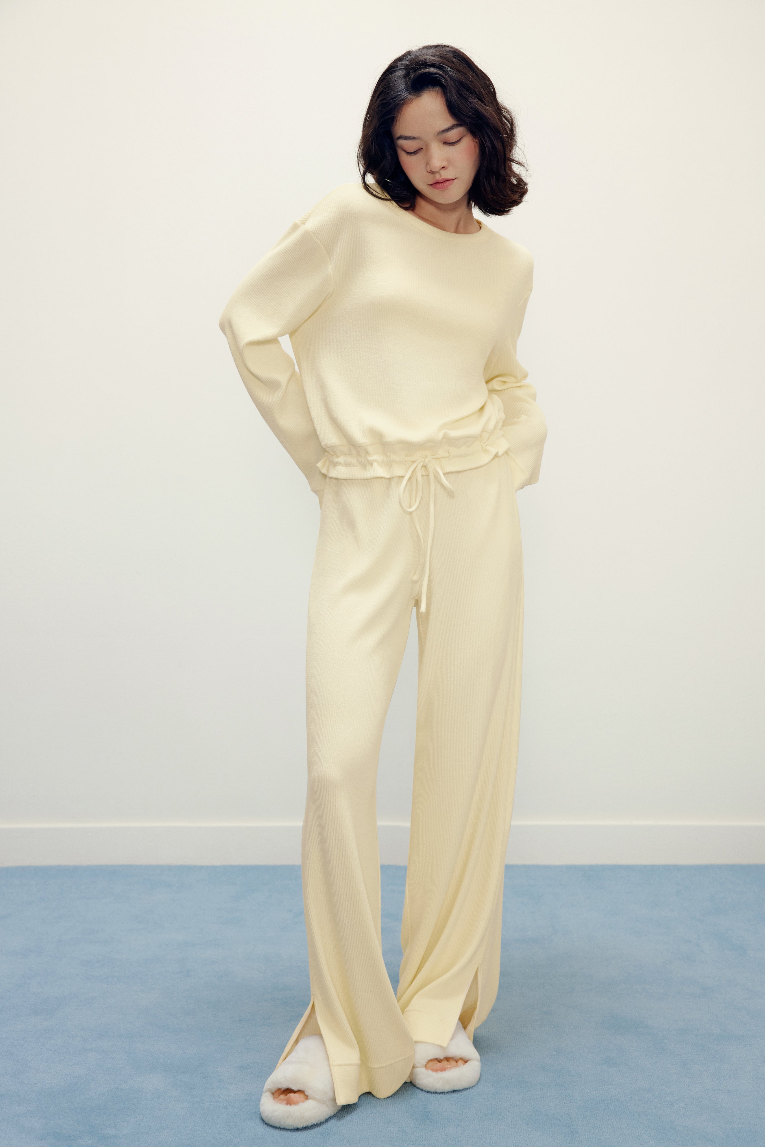 woman in yellow pajama top and pants
