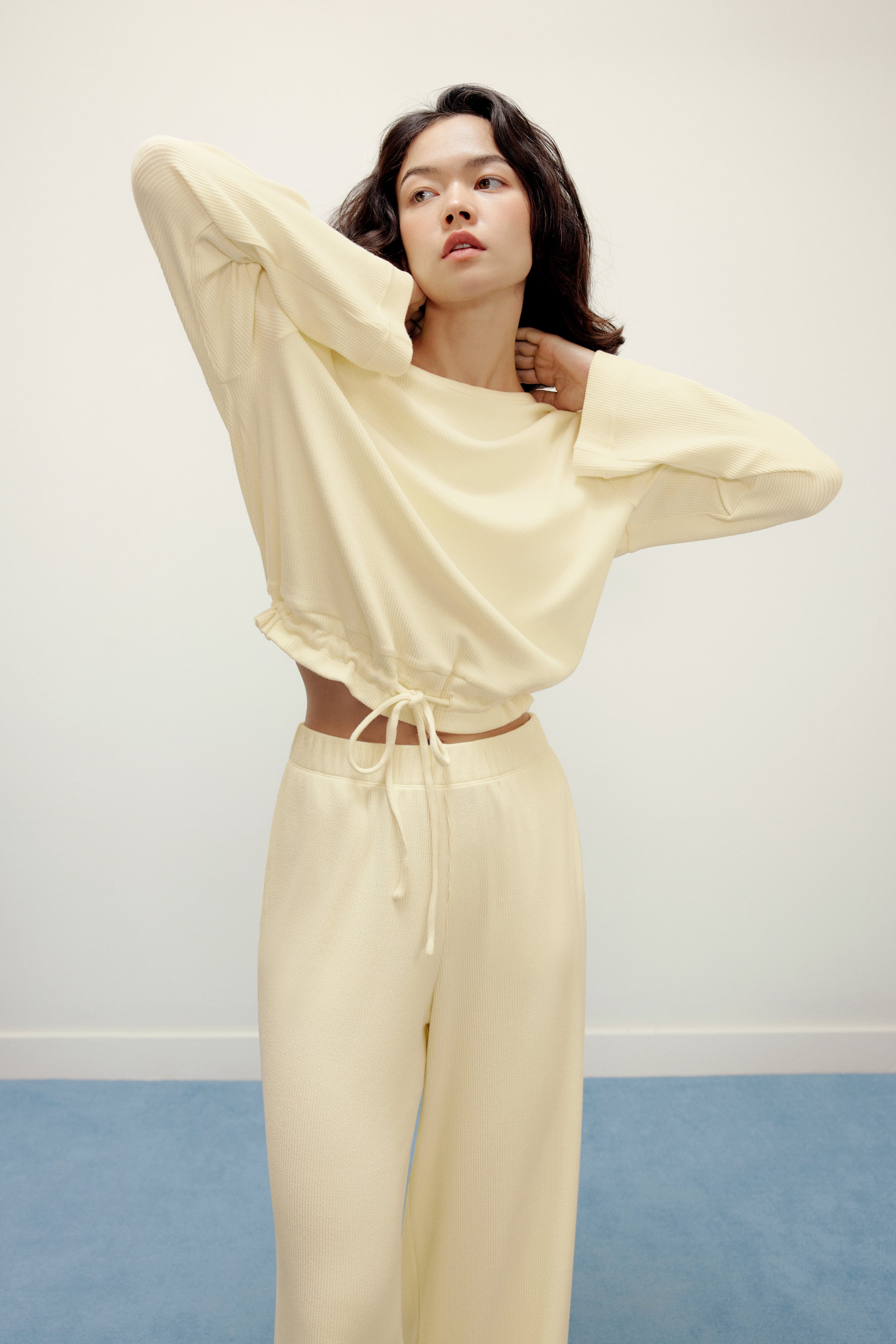 woman in yellow pajama top and pants