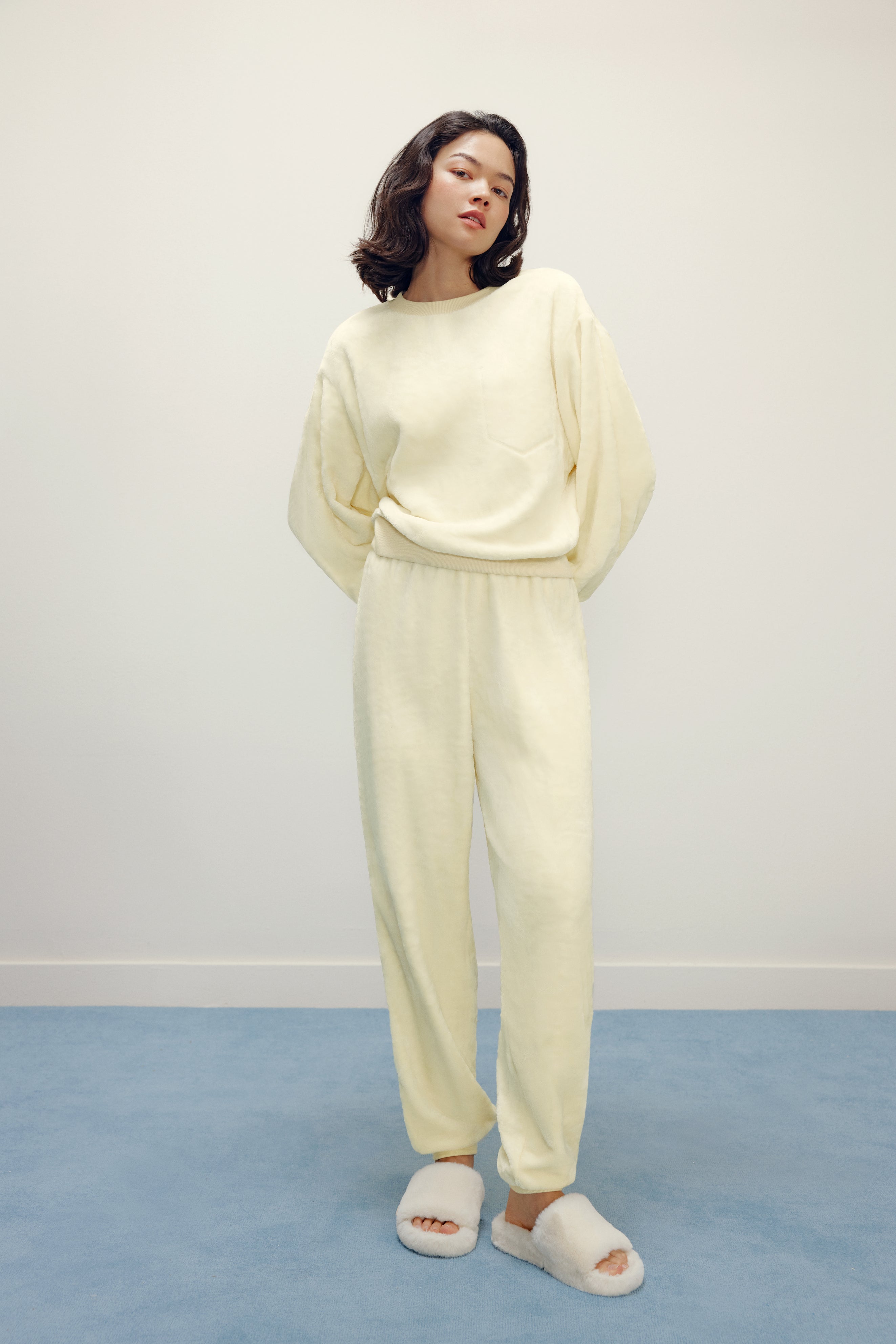 Women with cream color fluffy loungewear set
