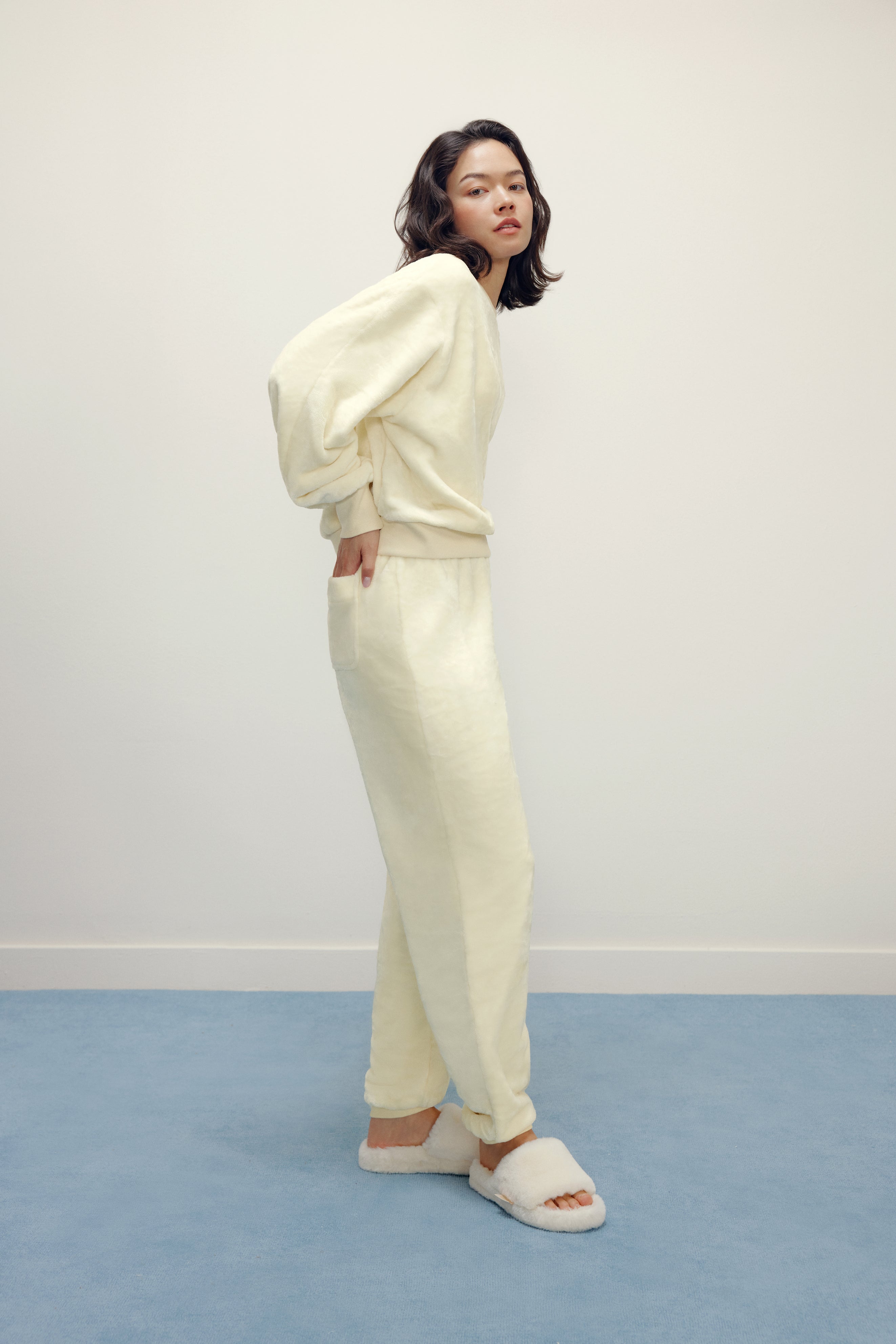 Women with cream color fluffy loungewear set