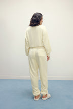 Women from back with cream color fluffy loungewear set