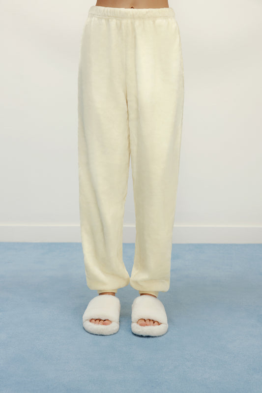 Women Legs with cream color fluffy lounge pants