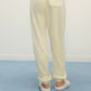 Women Legs from back with cream color fluffy lounge pants