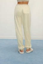 Women Legs from back with cream color fluffy lounge pants