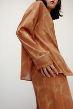 woman wearing brown color pajama from side
