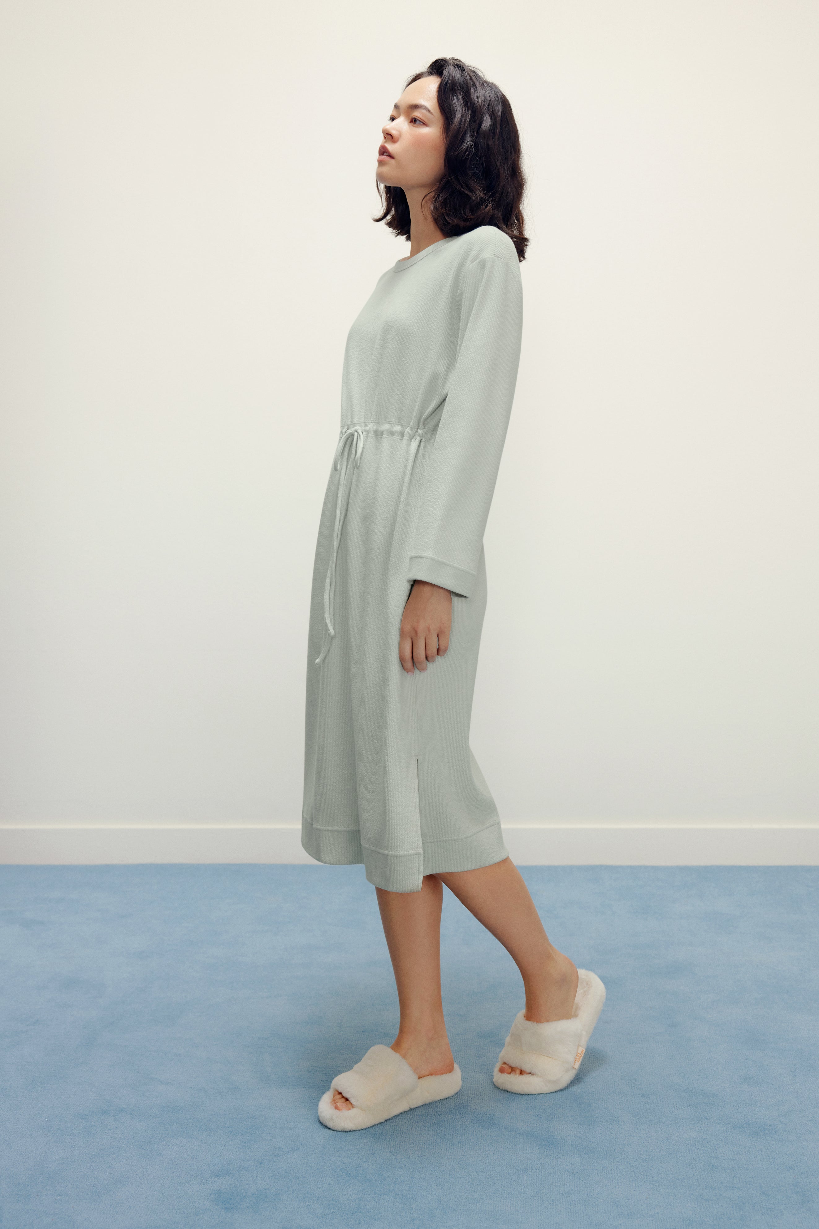 woman in mint pajama longe sleeve dress with waist drawstring