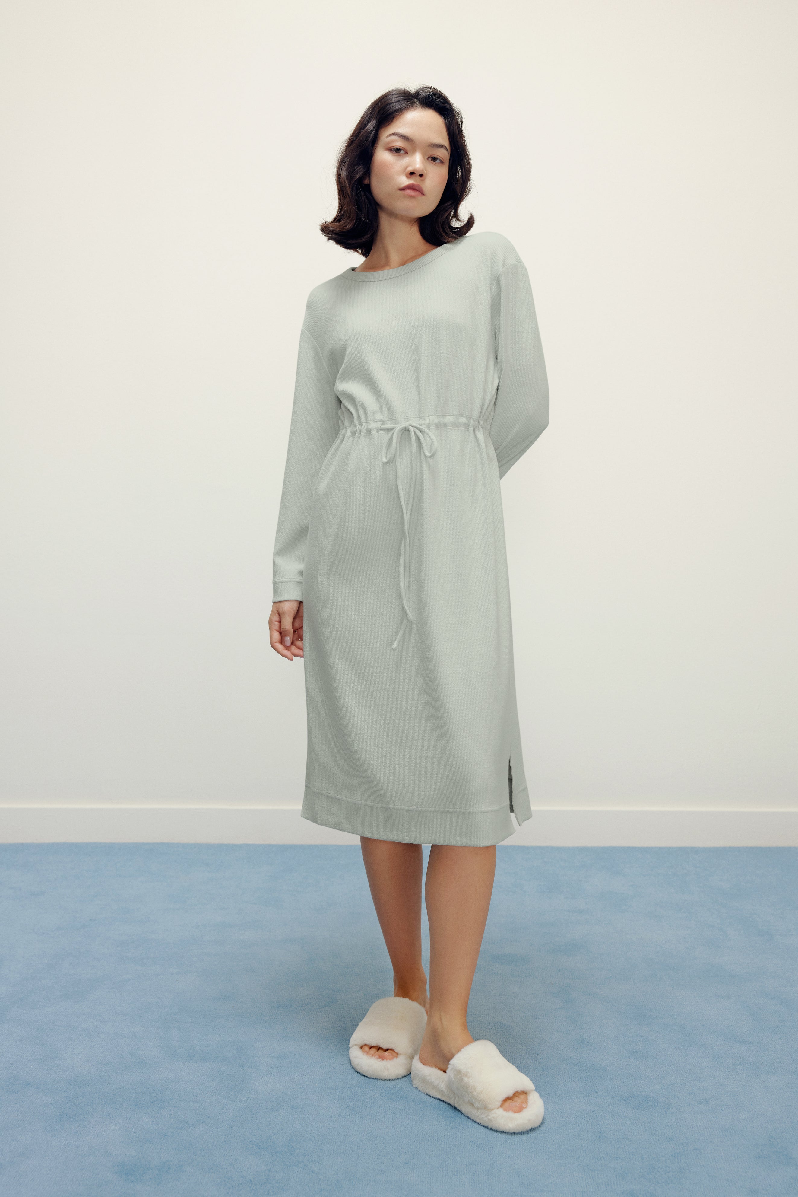 woman in mint pajama longe sleeve dress with waist drawstring